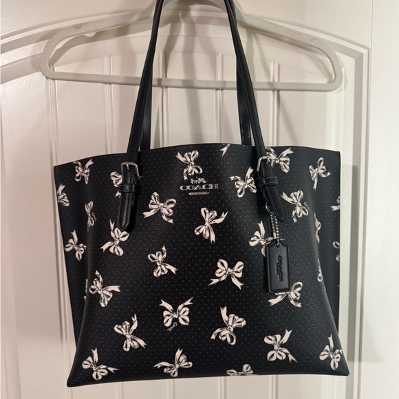 Coach Handbags - Coach Black Tote with White Bow Print
